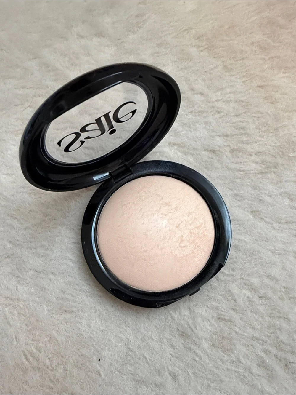 Saie Slip Tint pressed powder shade 1 translucent